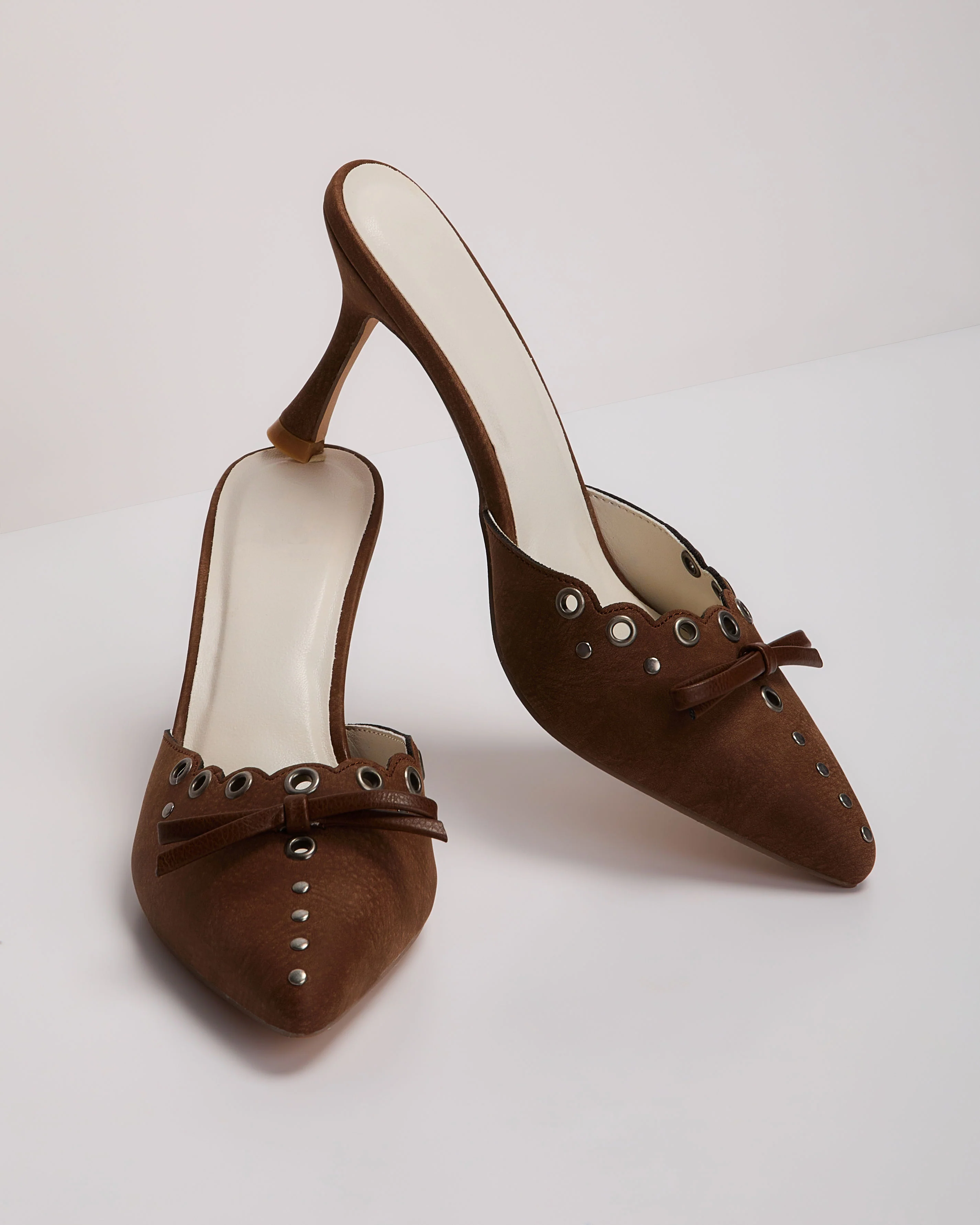 Mara Grommet and Bow Pointed Toe Mules
